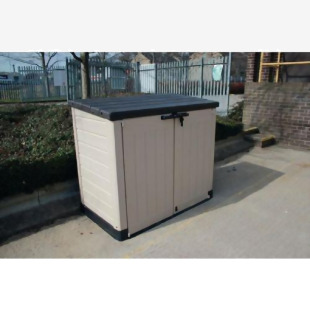 In the image, the Slingsby outdoor storage box is shown in a sturdy, brown design with lockable doors and a large storage capacity. Surrounding the box are various outdoor tools and equipment, highlighting its usefulness for organizing and storing outdoor items.