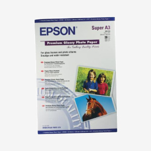The image shows a pack of 20 sheets of Epson Premium Glossy Photo Paper, specifically designed for A3+ printing. The paper has a weight of 255gsm and features a high-quality glossy finish, perfect for professional photos.