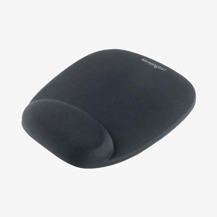 This image features a black Kensington Foam Mouse Mat with a cushioned wristrest, ideal for long hours of computer use. The mat has a smooth texture and features the Kensington logo in the bottom corner.