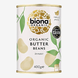 A six-pack of 400g Biona Organic Butter Beans shows six identical cans with white-and-green labels. Each label features the Biona logo, an image of pale butter beans, organic certification marks and soft green accents. The cans sit in a tidy rectangular arrangement. Clean lighting and plain backdrop