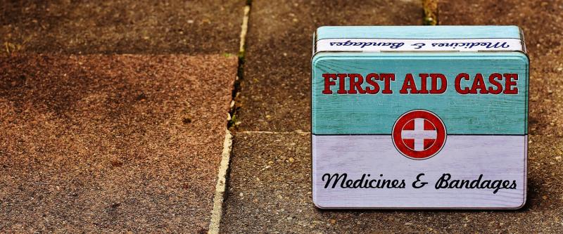first aid box on brick floor