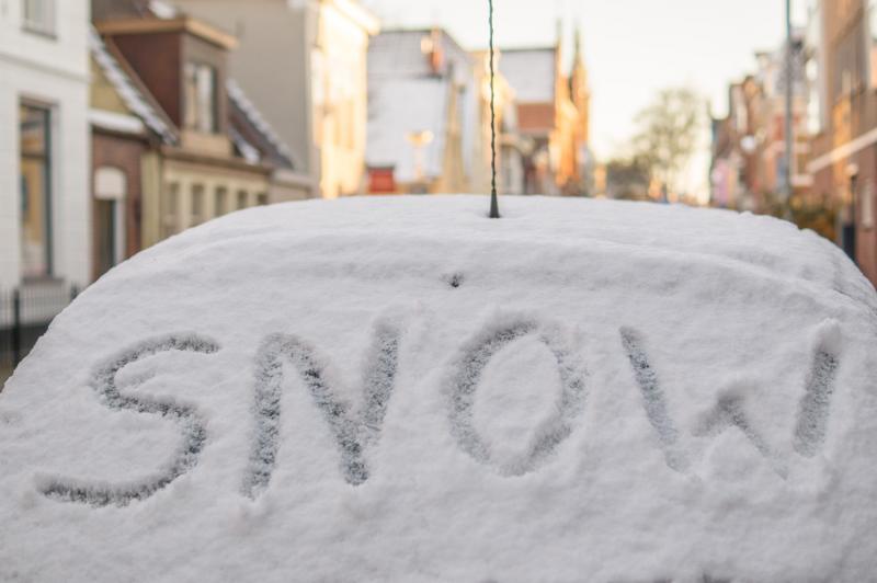 snow written in snow on car 