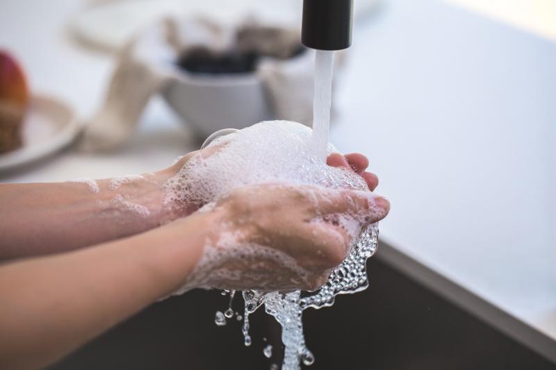 washing hands filled with soap bubbles