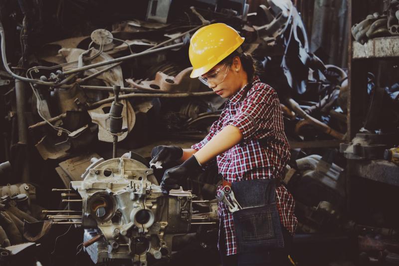 woman wearing hard hat building