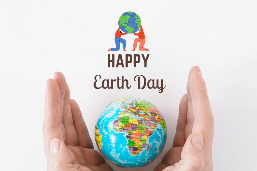 Hands open holding a globe with Happy Earth Day text above