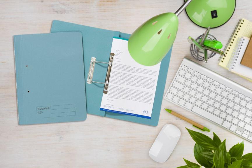 Picture of Desk with Green Lamp and Guildhall Manilla Filing Wallet. 